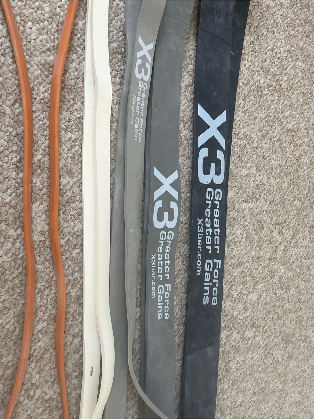 X3 home gym including the lightest band (orange)